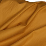 پارچه لباسی 100% پنبه عرض 150 بروجرد ساده رنگ خردلی کد 0220